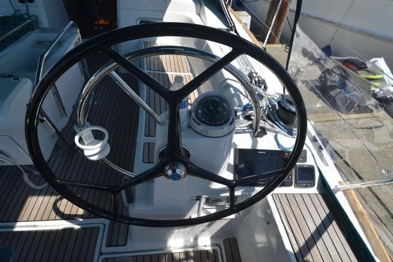 Leah Yacht Photos Pics Steering wheel of 2014 Jeanneau Sun Odyssey 469 sailboat with navigation instruments.