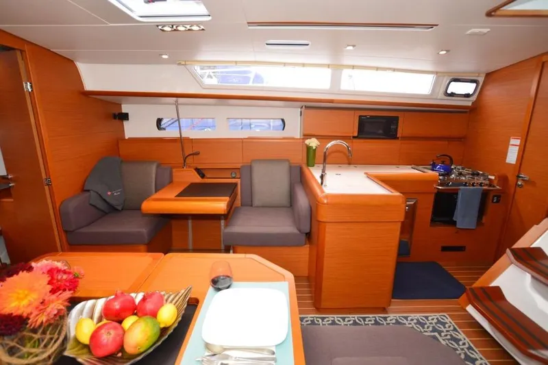 Leah Yacht Photos Pics Interior of 2014 Jeanneau Sun Odyssey 469 yacht with modern kitchen and dining area.