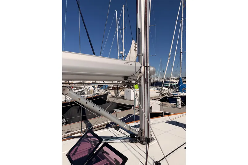 Leah Yacht Photos Pics 2014 Jeanneau Sun Odyssey 469 sailboat mast and rigging in marina setting.