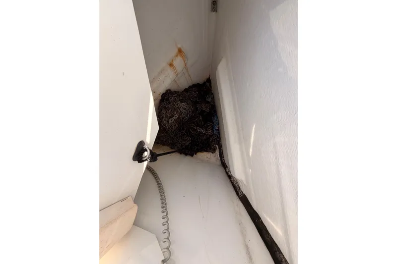 Leah Yacht Photos Pics Anchor locker of 2014 Jeanneau Sun Odyssey 469 sailboat with coiled rope.