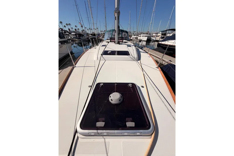 Leah Yacht Photos Pics 2014 Jeanneau Sun Odyssey 469 sailboat deck view in marina setting.