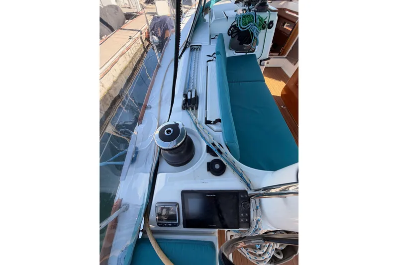 Leah Yacht Photos Pics 2014 Jeanneau Sun Odyssey 469 sailboat deck with winch, ropes, and navigation equipment.