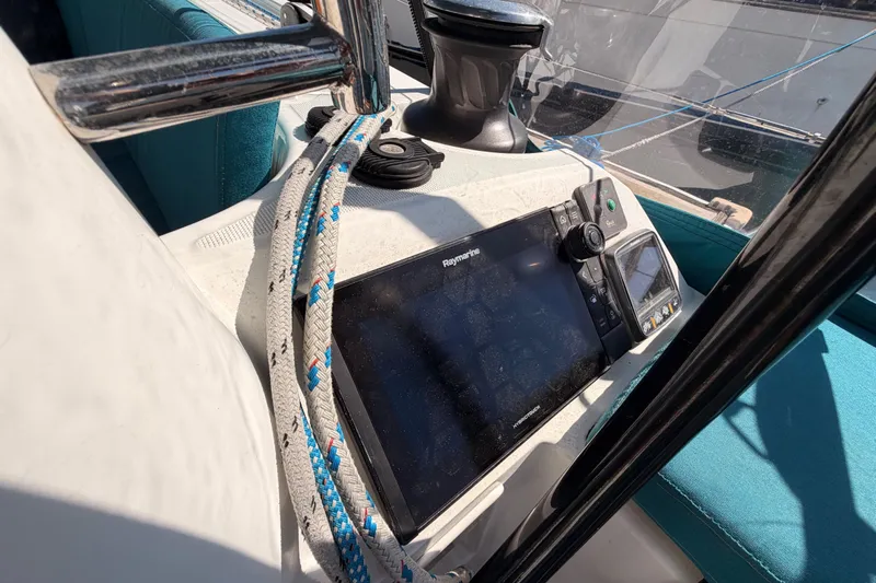 Leah Yacht Photos Pics Cockpit of 2014 Jeanneau Sun Odyssey 469 with navigation equipment and ropes.