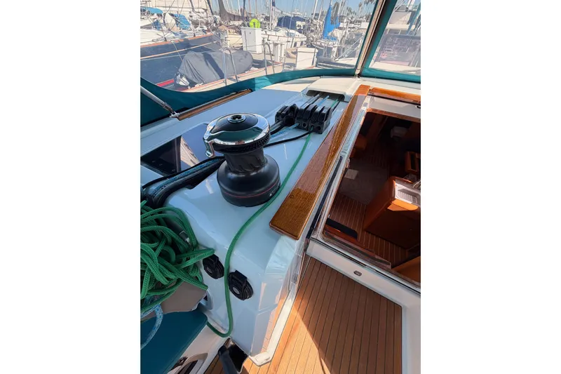 Leah Yacht Photos Pics 2014 Jeanneau Sun Odyssey 469 yacht deck with winch and green rope.