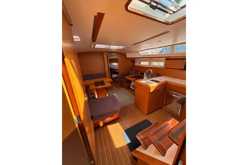 Leah Yacht Photos Pics Interior of 2014 Jeanneau Sun Odyssey 469 yacht, featuring modern kitchen and seating area.