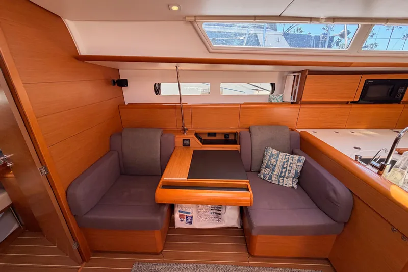 Leah Yacht Photos Pics 2014 Jeanneau Sun Odyssey 469 interior with cozy seating and modern kitchen area.