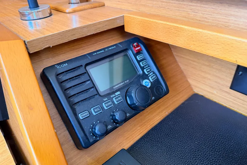 Leah Yacht Photos Pics VHF marine radio on 2014 Jeanneau Sun Odyssey 469 yacht's wooden interior.