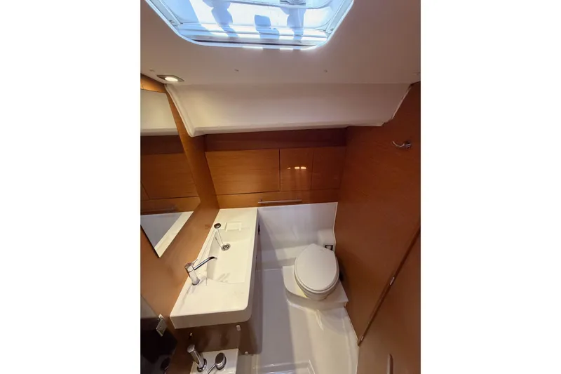Leah Yacht Photos Pics Interior of 2014 Jeanneau Sun Odyssey 469 yacht bathroom with modern fixtures and skylight.