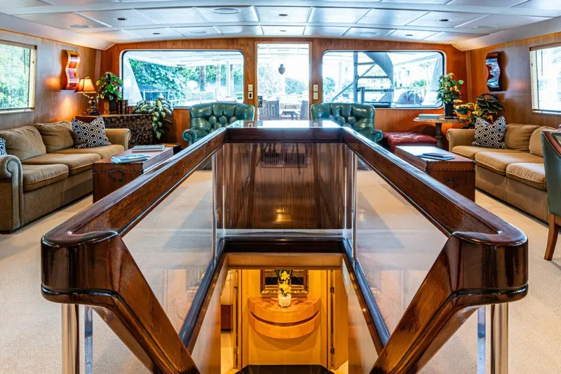 Le Montrachet Yacht Photos Pics Luxurious 1986 Broward Flybridge yacht interior with elegant wood finishes and plush seating.