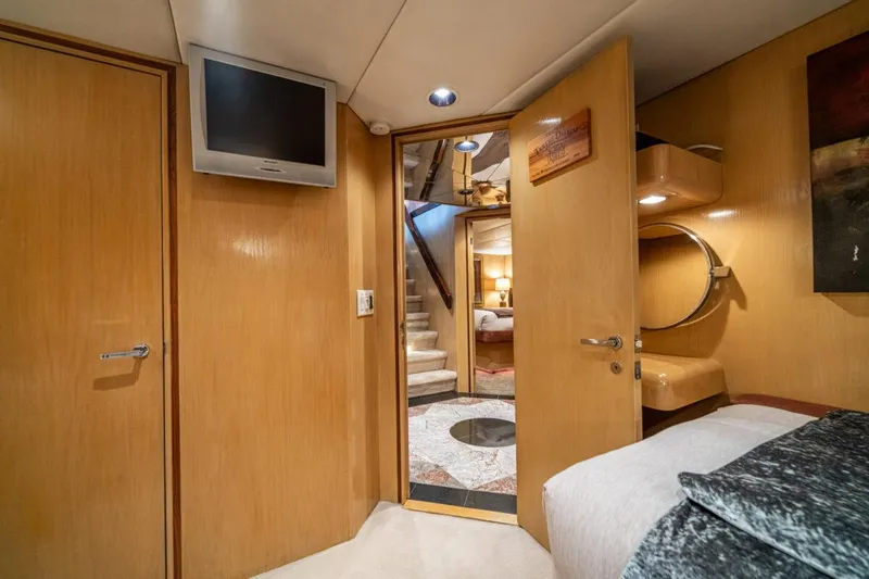 Le Montrachet Yacht Photos Pics Luxurious 1986 Broward Flybridge yacht interior with wood paneling and modern amenities.