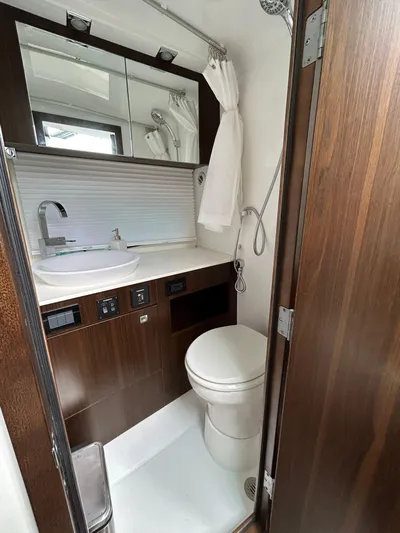 2024 Cruisers Yachts 34 Gls Ob Yacht Photos Pics 2024 Cruisers Yachts 34 GLS OB bathroom with modern fixtures and wood accents.