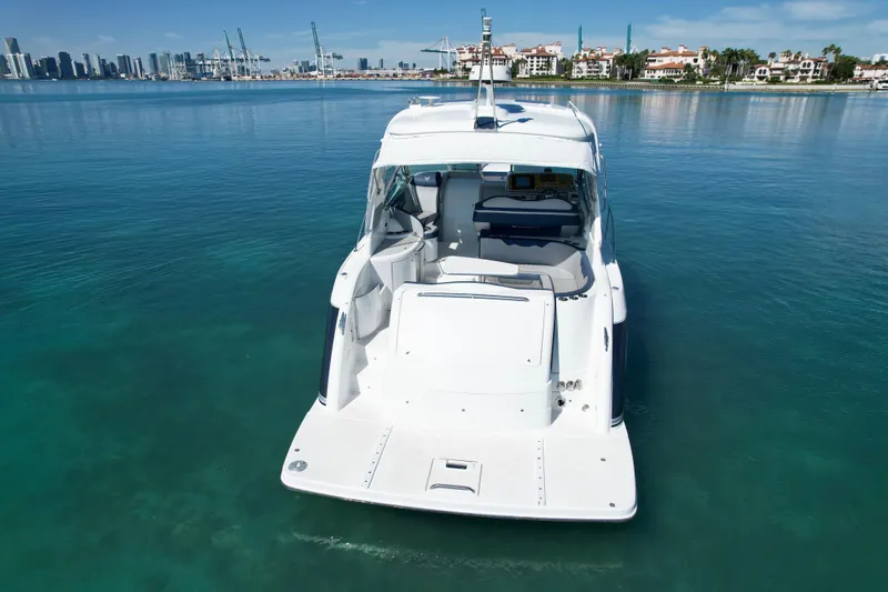  Yacht Photos Pics 2006 Formula 40 Performance Cruiser on calm water with city skyline backdrop.