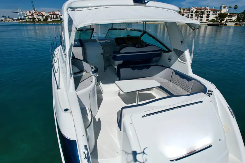  Yacht Photos Pics 2006 Formula 40 Performance Cruiser with spacious deck and seating, docked in serene waters.