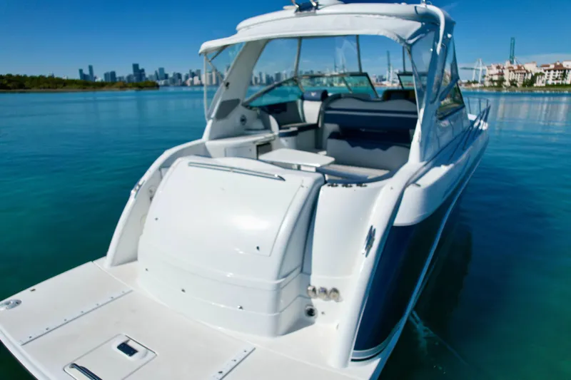  Yacht Photos Pics 2006 Formula 40 Performance Cruiser on calm water with city skyline in background.