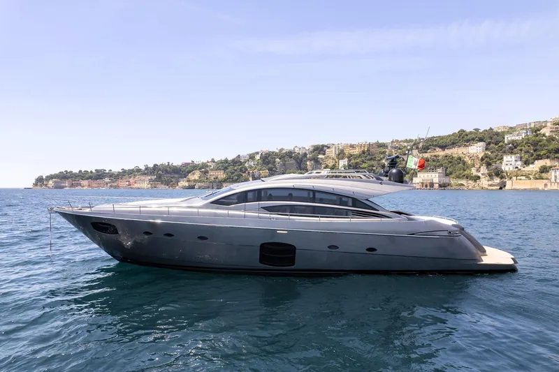 Mylo Yacht Photos Pics 2014 Pershing 74 yacht on calm sea with scenic coastal backdrop.