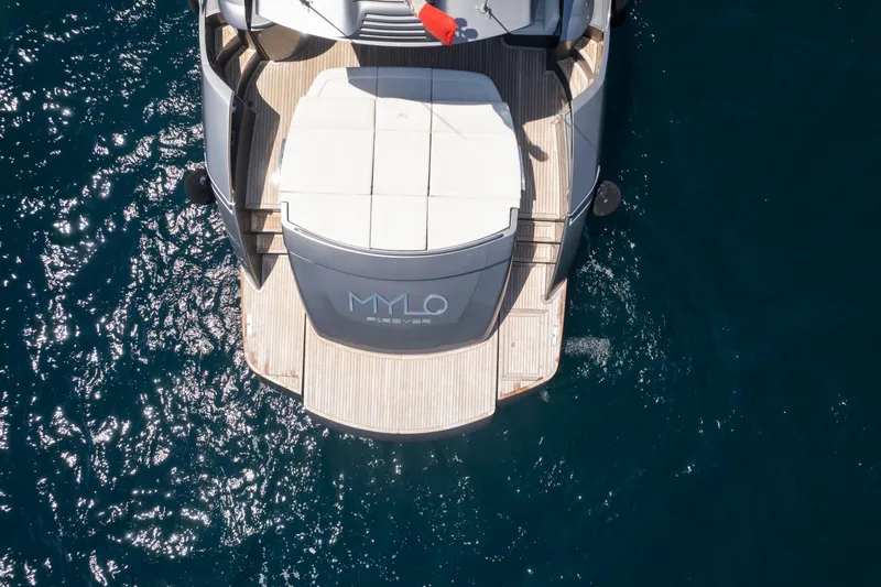 Mylo Yacht Photos Pics Aerial view of 2014 Pershing 74 yacht on blue ocean water.