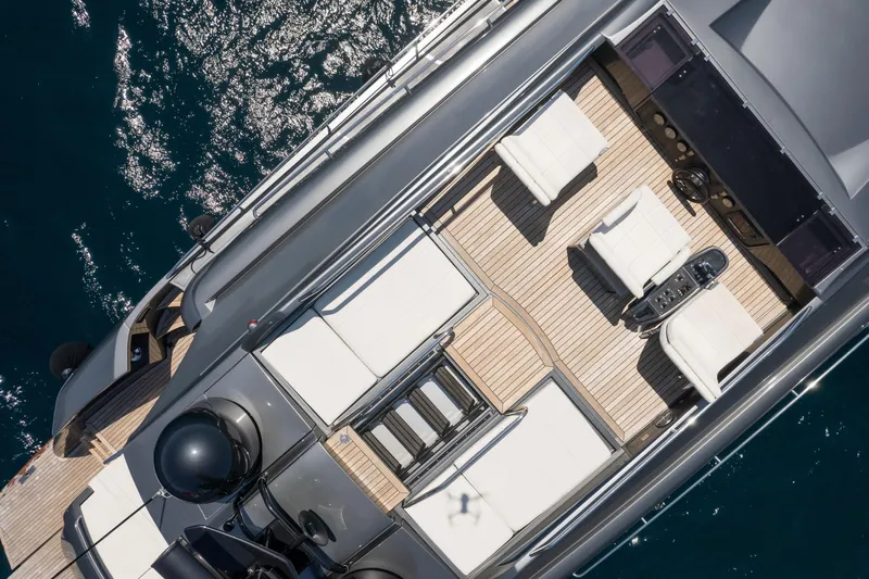 Mylo Yacht Photos Pics Aerial view of 2014 Pershing 74 yacht deck with seating and controls.