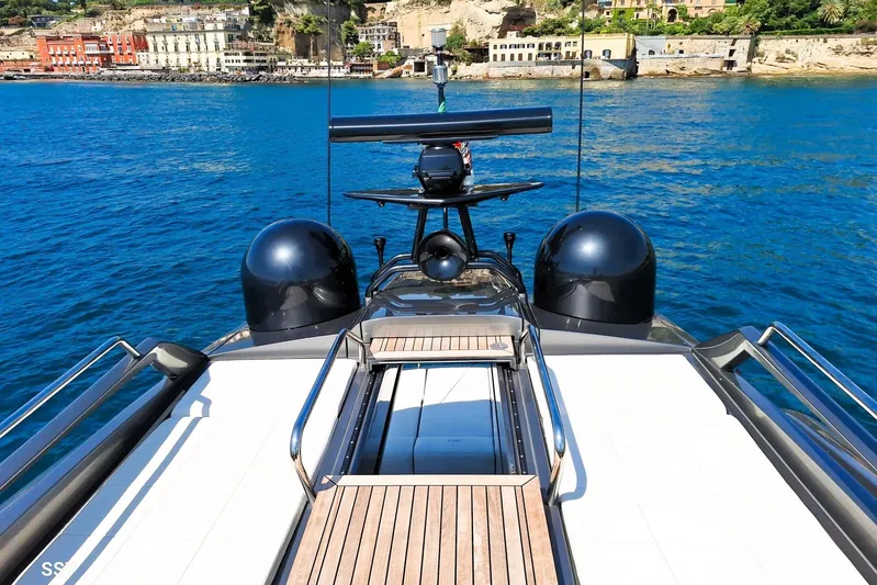 Mylo Yacht Photos Pics Luxurious 2014 Pershing 74 yacht docked by scenic coastal town.