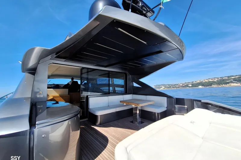 Mylo Yacht Photos Pics 2014 Pershing 74 yacht with sleek design, spacious deck, and luxurious seating.