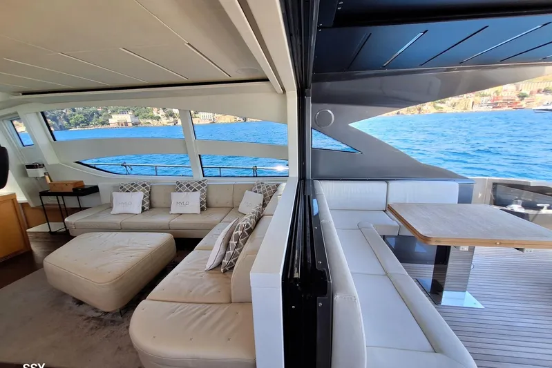 Mylo Yacht Photos Pics Luxurious interior of 2014 Pershing 74 yacht with elegant seating and ocean view.