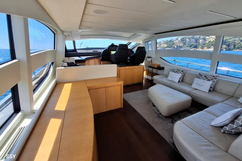 Mylo Yacht Photos Pics Luxurious interior of 2014 Pershing 74 yacht with elegant seating and ocean view.