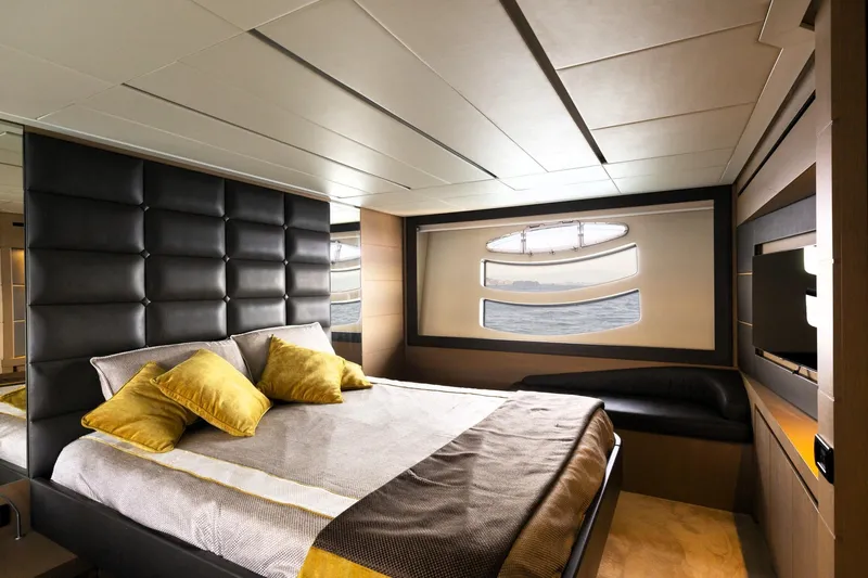 Mylo Yacht Photos Pics Luxurious bedroom interior on 2014 Pershing 74 yacht with modern design and ocean view.