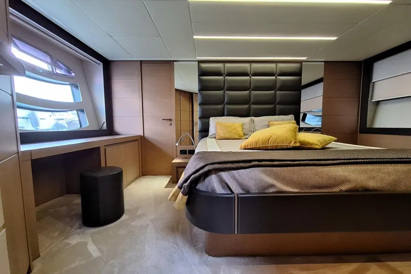 Mylo Yacht Photos Pics Luxurious bedroom interior of 2014 Pershing 74 yacht with modern design and elegant furnishings.