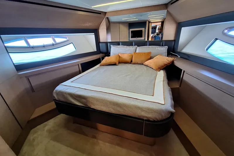 Mylo Yacht Photos Pics Luxurious bedroom interior of 2014 Pershing 74 yacht with modern design and ocean view.