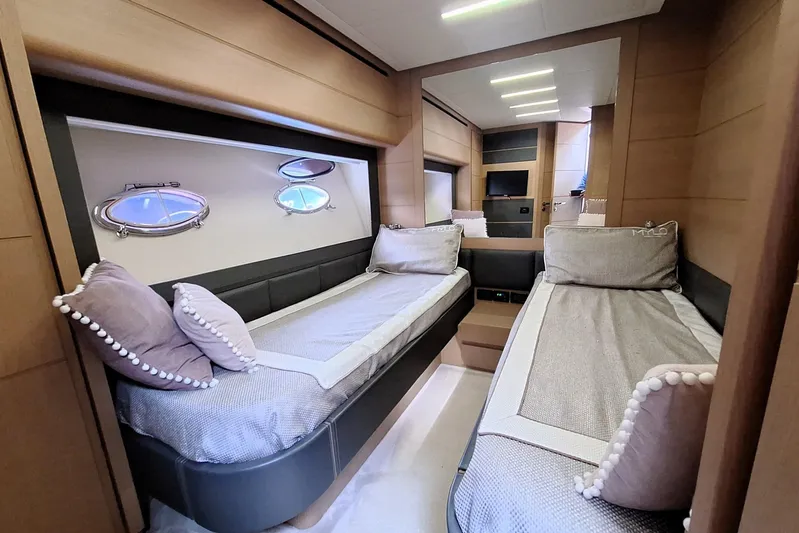 Mylo Yacht Photos Pics Luxurious twin cabin interior of 2014 Pershing 74 yacht with modern design and porthole windows.
