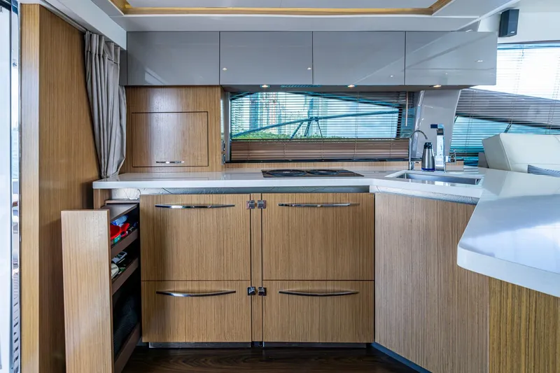  Yacht Photos Pics Luxurious 2018 Sea Ray L550 Fly yacht kitchen with modern wood cabinetry and sleek countertops.