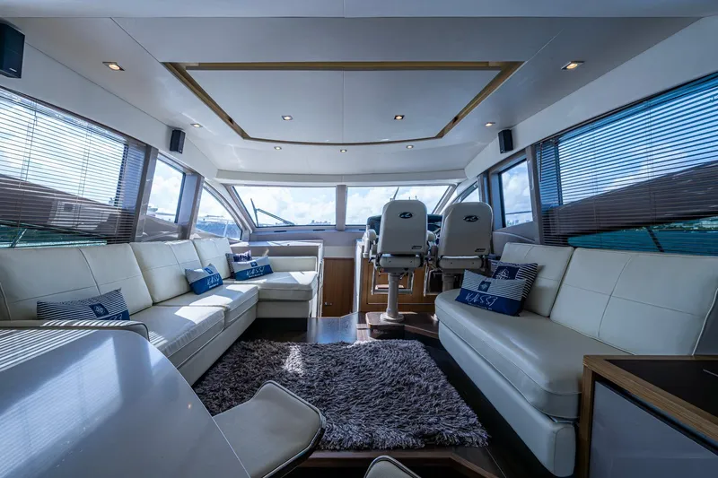  Yacht Photos Pics Luxurious interior of 2018 Sea Ray L550 Fly yacht with plush seating and modern design.