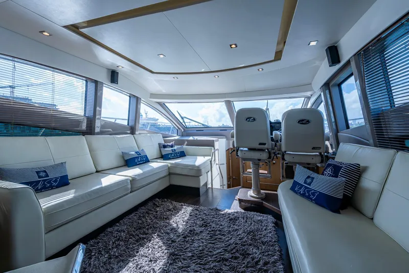  Yacht Photos Pics Luxurious interior of 2018 Sea Ray L550 Fly yacht with plush seating and modern design.