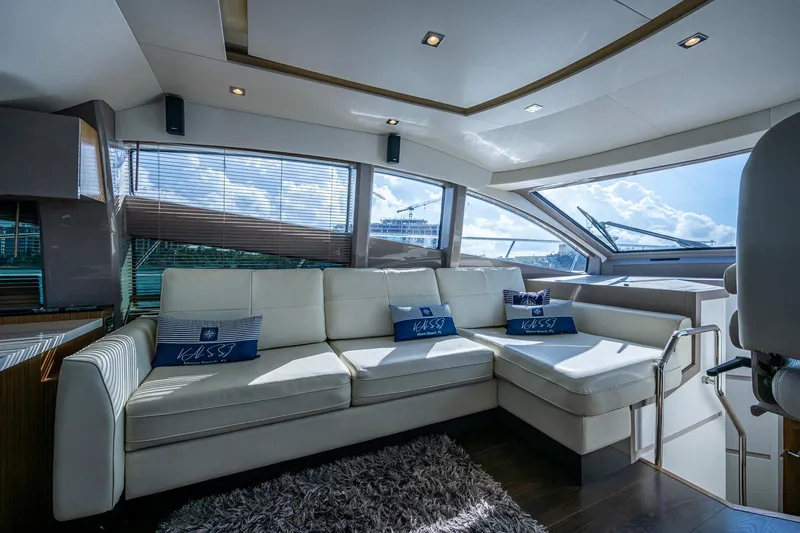  Yacht Photos Pics Luxurious interior of 2018 Sea Ray L550 Fly yacht with plush white seating.
