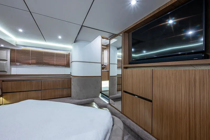  Yacht Photos Pics Luxurious interior of 2018 Sea Ray L550 Fly yacht with modern wood paneling and large TV.