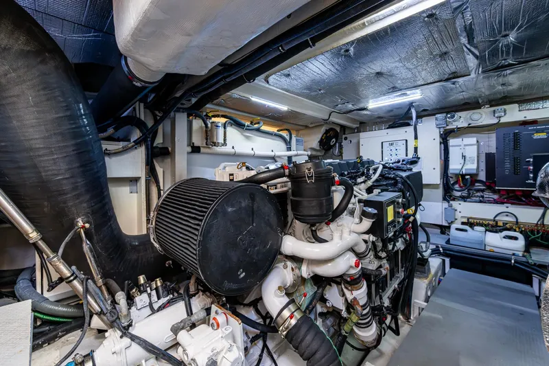  Yacht Photos Pics Engine room of 2018 Sea Ray L550 Fly yacht, showcasing complex machinery and components.