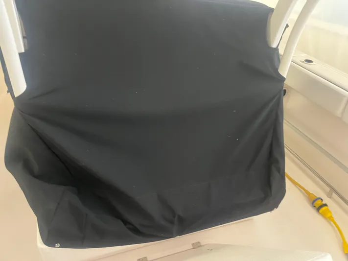  Yacht Photos Pics 2021 Robalo R272 Center Console with black cover, interior view.