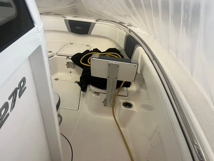  Yacht Photos Pics 2021 Robalo R272 Center Console boat interior with seating and storage.