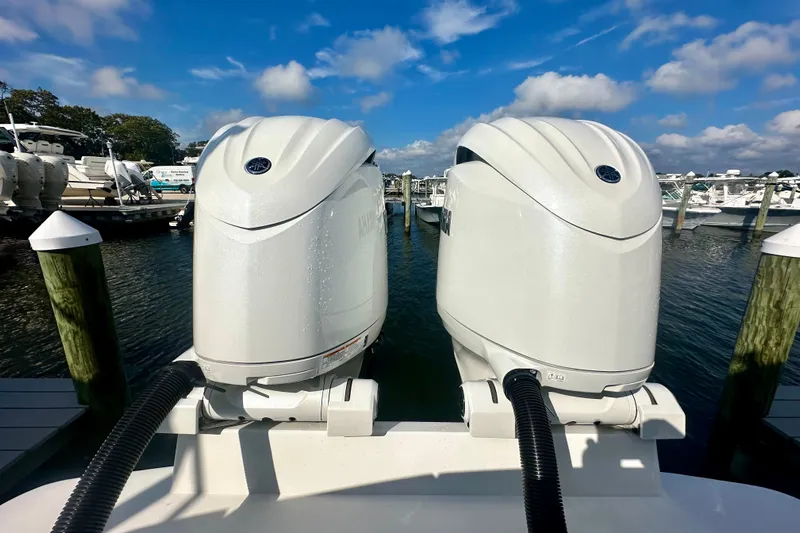  Yacht Photos Pics Twin outboard motors on a 2025 Regulator 23 boat at a marina.