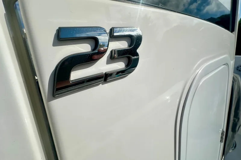  Yacht Photos Pics Chrome "23" emblem on 2025 Regulator boat exterior.