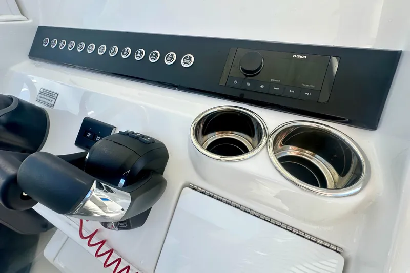  Yacht Photos Pics Control panel of 2025 Regulator 23 boat with audio system and cup holders.