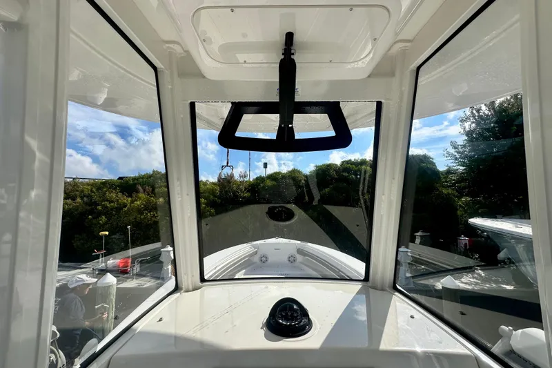  Yacht Photos Pics Interior view of 2025 Regulator 23 boat, showcasing helm and windshield.