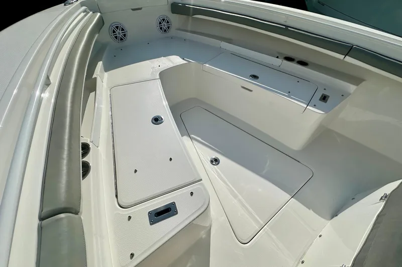  Yacht Photos Pics 2025 Regulator 23 boat interior with storage compartments and seating.