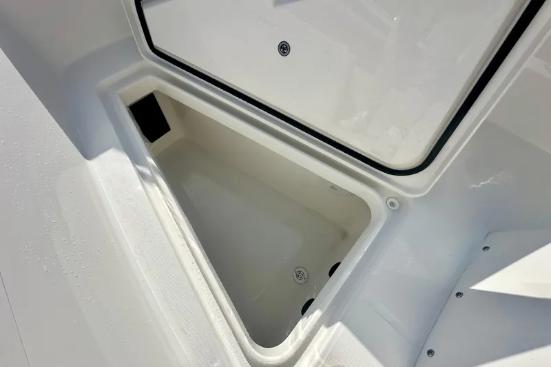  Yacht Photos Pics Open storage compartment on 2025 Regulator 23 boat, showcasing interior space.