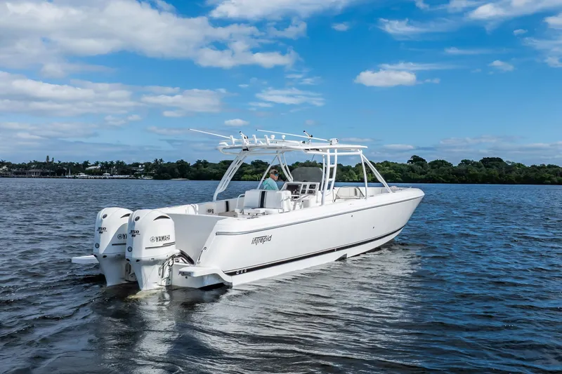  Yacht Photos Pics 2011 Intrepid 400 Center Console boat cruising on a sunny day.