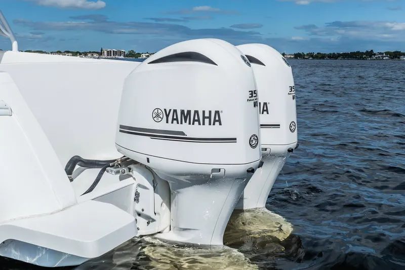  Yacht Photos Pics Twin Yamaha outboard engines on a 2011 Intrepid 400 Center Console boat in open water.