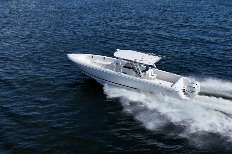  Yacht Photos Pics 2011 Intrepid 400 Center Console boat cruising on open water.