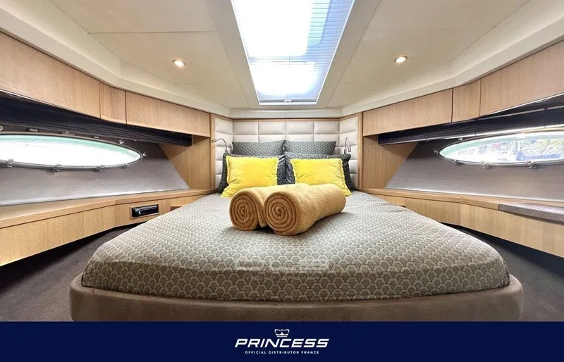  Yacht Photos Pics Luxurious 2012 Princess 64 yacht bedroom with skylight and elegant decor.