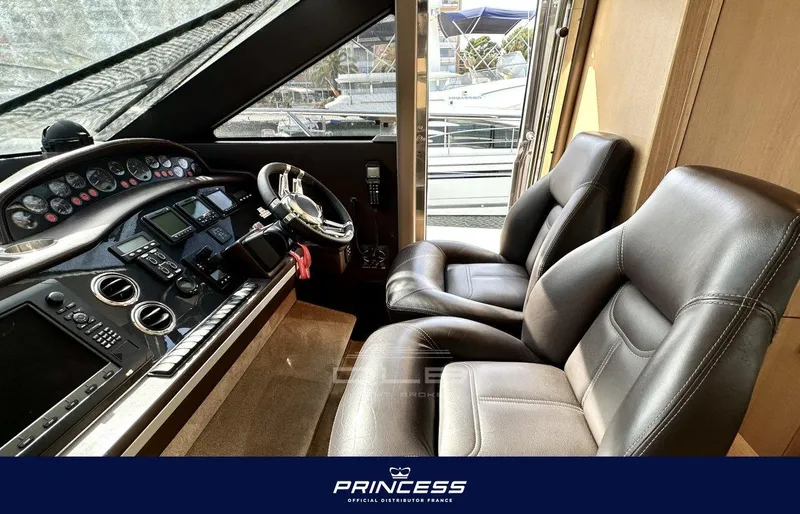  Yacht Photos Pics Interior cockpit of 2012 Princess 64 yacht with leather seats and control panel.
