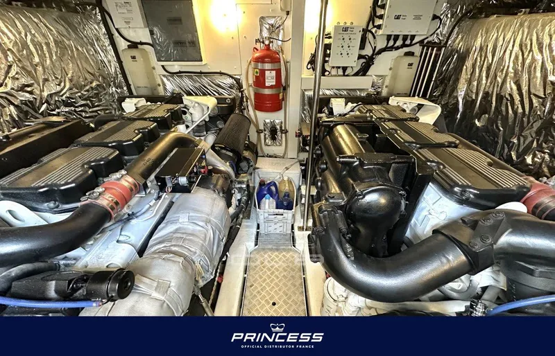  Yacht Photos Pics Engine room of a 2012 Princess 64 yacht, featuring dual engines and safety equipment.