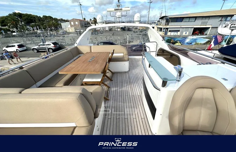  Yacht Photos Pics Luxurious 2012 Princess 64 yacht with spacious outdoor seating and dining area.